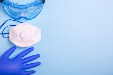 Coronavirus personal protective equipment (PPE)  concept. Medical latex gloves, protective goggles...