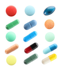 Set of different pills on white background