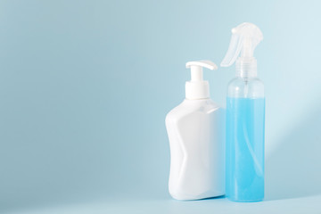 flat lay, top view, antiseptic, disinfector, medical gloves, mask - personal protective equipment and hygiene during the epidemic coronavirus on blue background