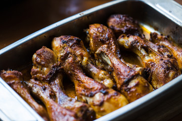 A photo of hot baked marinated chicken legs
