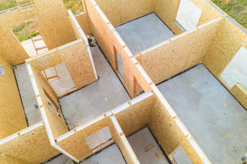 Construction of new and modern modular house. Walls made from composite wooden sip panels with...