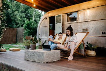 Travelling couple watching a film on tablet