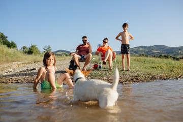 Family enjoying a nice day at the lake