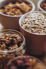 a delicious and crunchy oatmeal granola with honey, nuts, dried fruits and grains. Dynamic healthy food photography