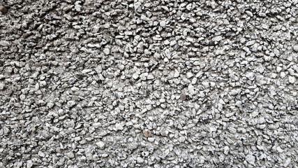 Little pebbles wall background.