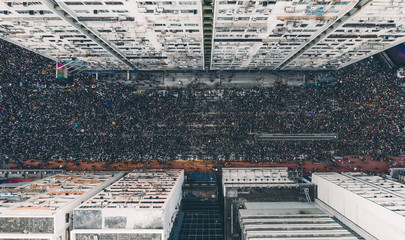 Overhead view of crowd on street in city