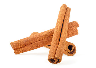 Close up of three cinnamon sticks isolated on a white background. Cinnamon bark.