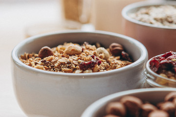 a delicious and crunchy oatmeal granola with honey, nuts, dried fruits and grains. Dynamic healthy food photography