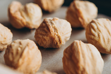 Homemade cookies with boiled condensed milk on a table background. Copy space