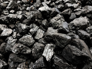 Natural black coals background texture. Top view of fuel for industrial coal