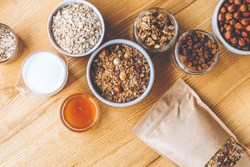 a delicious and crunchy oatmeal granola with honey, nuts, dried fruits and grains. Dynamic healthy food photography