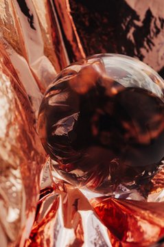 Pink gold or copper and crystal ball abstract shot