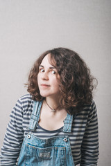woman overhears dressed in overalls