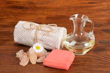 Fototapeta na wymiar homemade soap, towel and body oil, natural bath salt, with free space for text