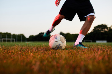 Man doing tricks with soccer ball.