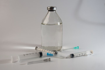 glass transparent bottle with syringes
