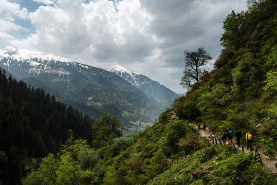 Group of five friends hiking in the Himalaya mountains
