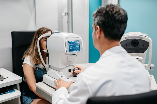 Oculist checking patient's eyes pressure, tonometry