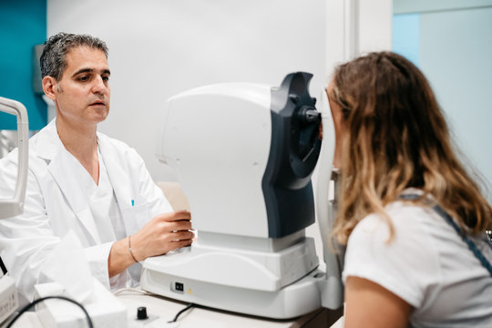 Oculist checking patient's eyes pressure, tonometry