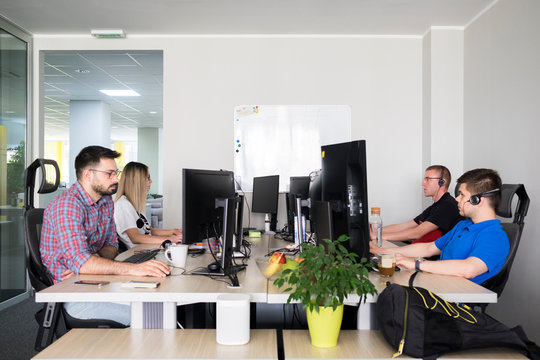 Young businesspeople working at the pet friendly office