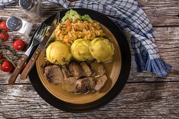 Braised pork tongues in horseradish sauce.