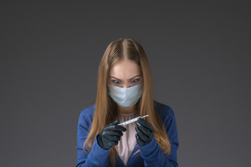The girl is sick. the woman's temperature rose. fear of contracting a virus. shocking news