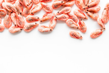 Shrimps background on white table top view frame copy space