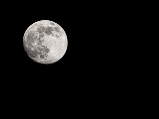 Full moon on black sky background