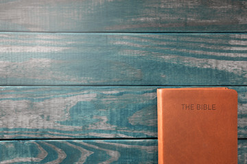 A Background with a Bible on a Rustic Wooden Table
