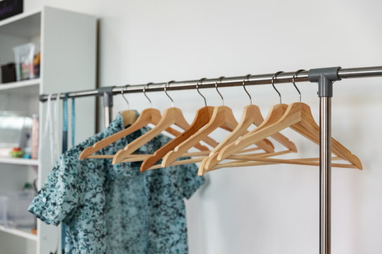 Row of hangers in dressmaking studio
