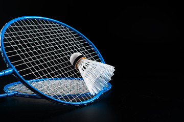 Badminton sport equipment on dark black background close up