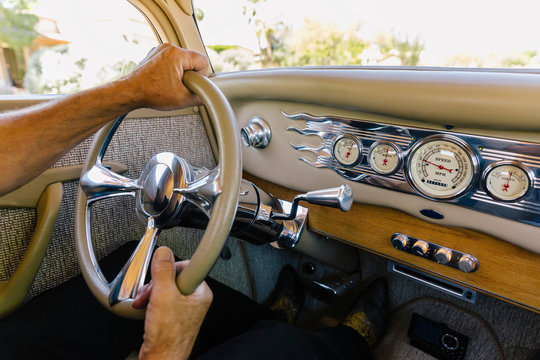 Hands on Steering Wheel in Car