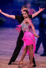 Latin Dancers in a Pink Dress Looking at the camera