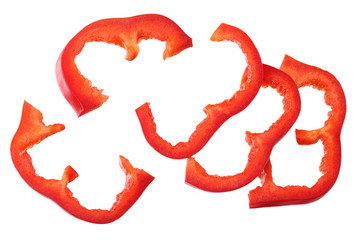 cut slices of red sweet bell pepper isolated on white background. top view