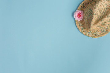 Summer composition. Hat on blue background. Summer concept. Flat lay, top view, copy space