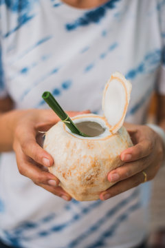 Coconut with banana leaf straw