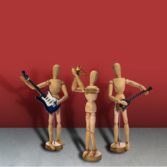 Wooden mannequin band stands on a red background