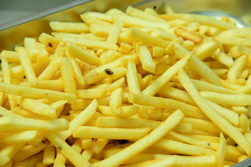 Delicious French fries piled up in a tray