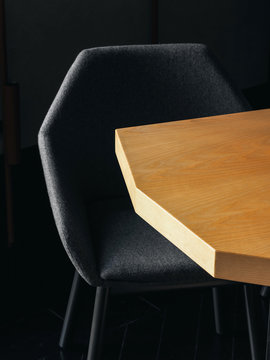 Black chair near irregular table
