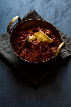 Vindaloo Indian Curry Dish with Crushed Papadum