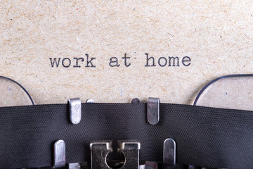 The word work at home written in typewriter font. The inscription in the old style on gray paper.