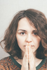 beautiful young girl prays