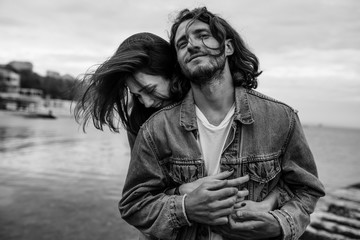 young couple embracing on the sea shore