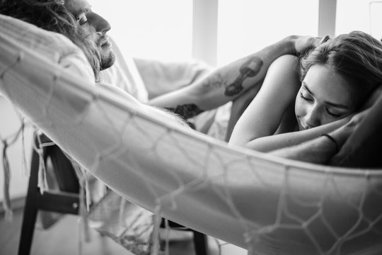 Young couple just woke up in a hammock