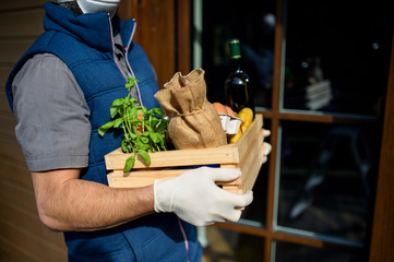 Courier delivering fresh fruit and vegetables shopping, corona virus and quarantine concept.