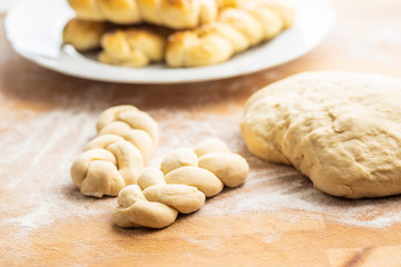 Fototapeta na wymiar Unbaked braided bun dough. Raw dough.