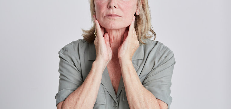 Woman closeup neck skincare mature skin