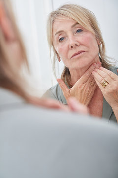Woman hydrating neck skin