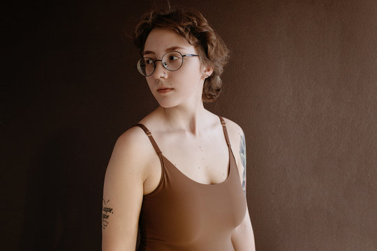 Woman in glasses looking away