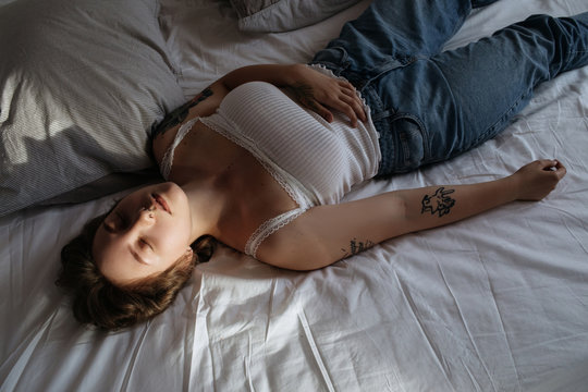 Sensual plump female lying on bed